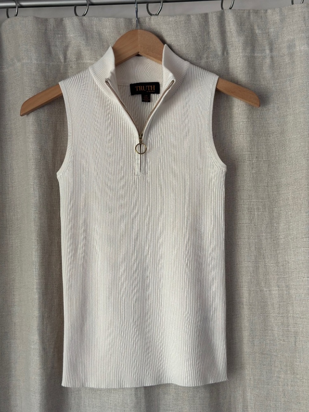 Truth Sleeveless 1/2 zip top.  Very cute.  Never worn!